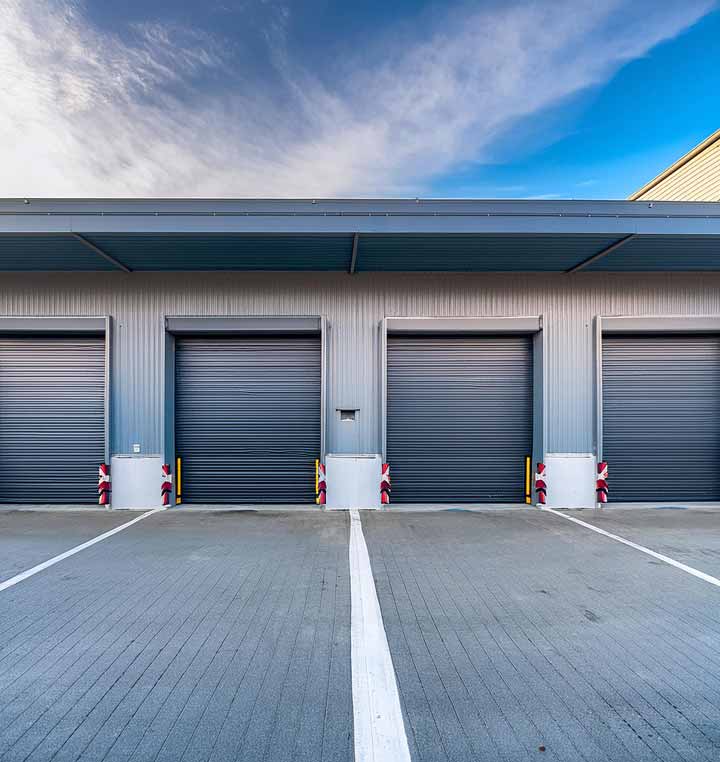 loading dock and overhead garage doors of warehouse