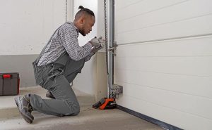 expert performing garage door repair